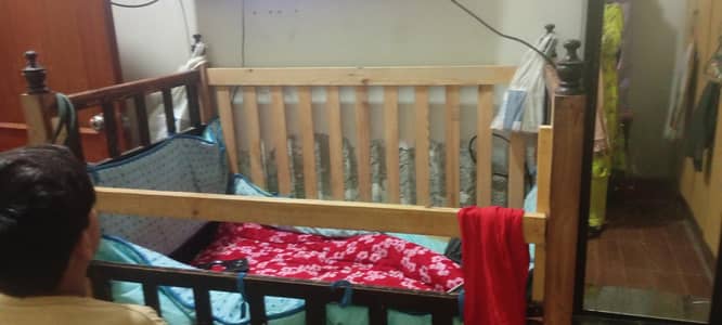 Baby Caught wooden with the walls