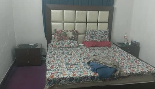 king side bed with side table and dressing