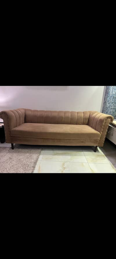 Brown three seater sofa