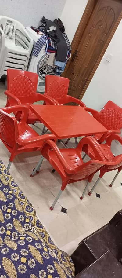 plastic chairs with iron legs and table with folding legs