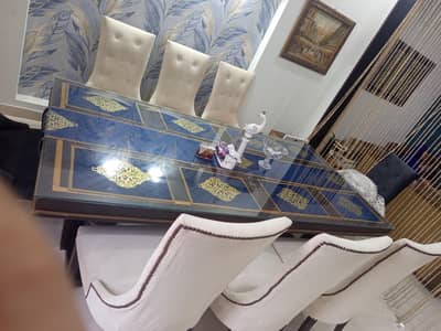 Luxury 8 seaters Dinning table sold wood with glass top