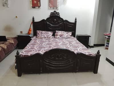 wooden bed with side tables