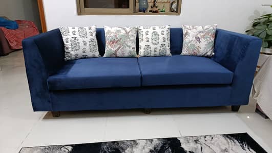 3 seater  blue velvet sofa .
