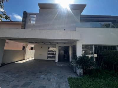 1 KANAL ELEGANT AND FULLY MAINTAINED SUPER HOT LOCATED BUNGALOW IS AVAILABLE IN THE BEST BLOCK OF DHA LAHORE