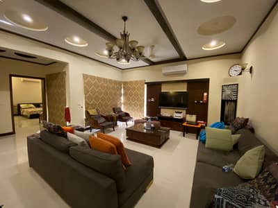 1 KANAL ELEGANT AND FULLY FURNISHED SUPER HOT LOCATED BUNGALOW WITH 10 KVA SOLAR IS AVAILABLE IN THE BEST BLOCK OF DHA LAHORE