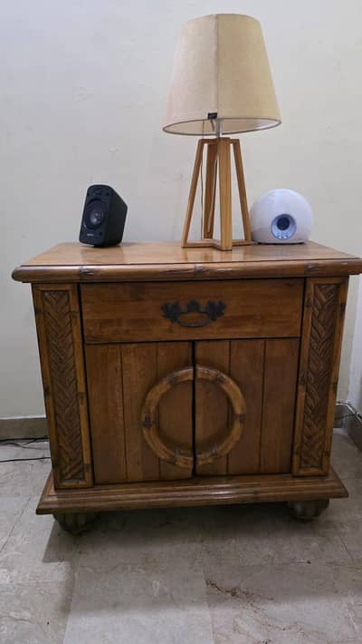 Wooden king size bed with 2 side tables and dressing table.