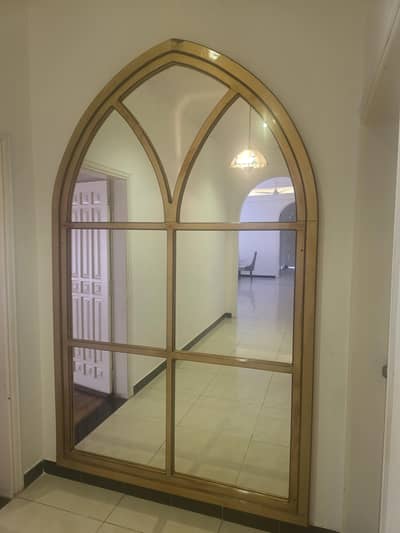 wall lobby mirror gold color on walnut wood