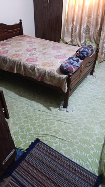 single bed and easy chair