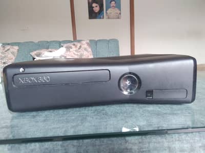 Xbox 360 Slim for sale.