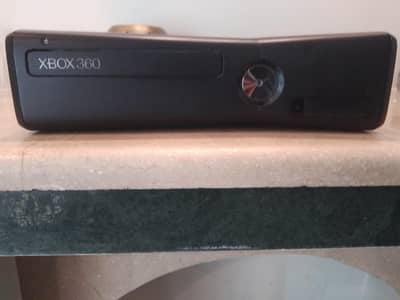 Xbox 360 Slim for sale.