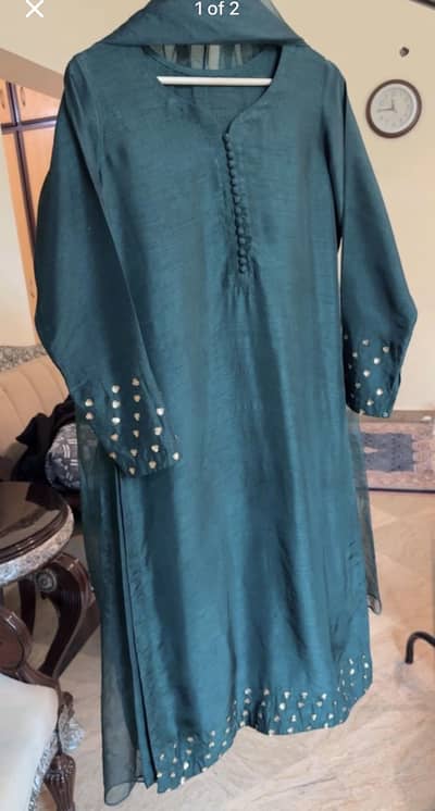 Bottle green raw silk dress with pure organza dupatta.