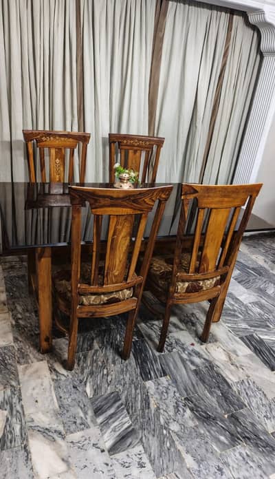 Wood dining table with heavy glass