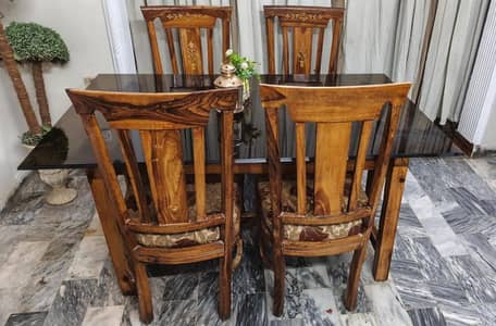 Wood dining table with heavy glass