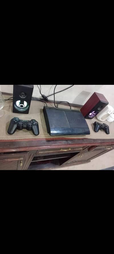 playstation 3 ultra slim model 500 GB with 2 controllers and 1 wire