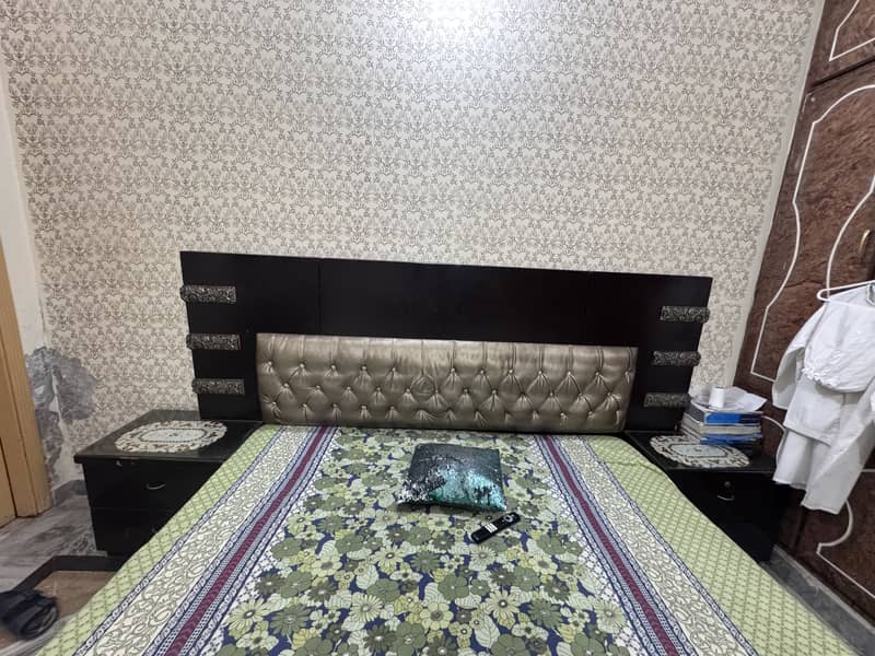 A king size bed and two side tables  and dressing table 2