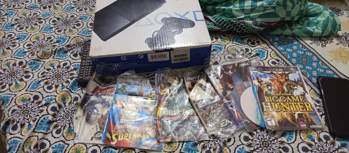 PS2 for sale with games excellent condition but without controller