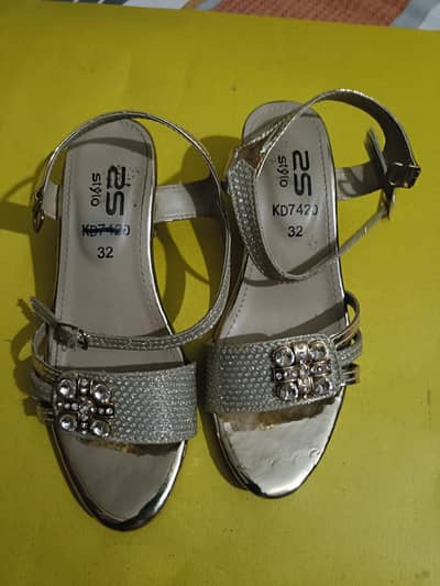 Golden color sandal  size 32