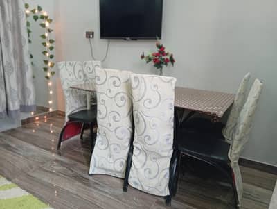 Dinning table with 6 chairs, chairs cover include. . . cover color white