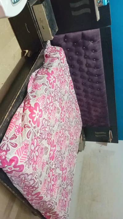 king size bed with upholstered headboard .
