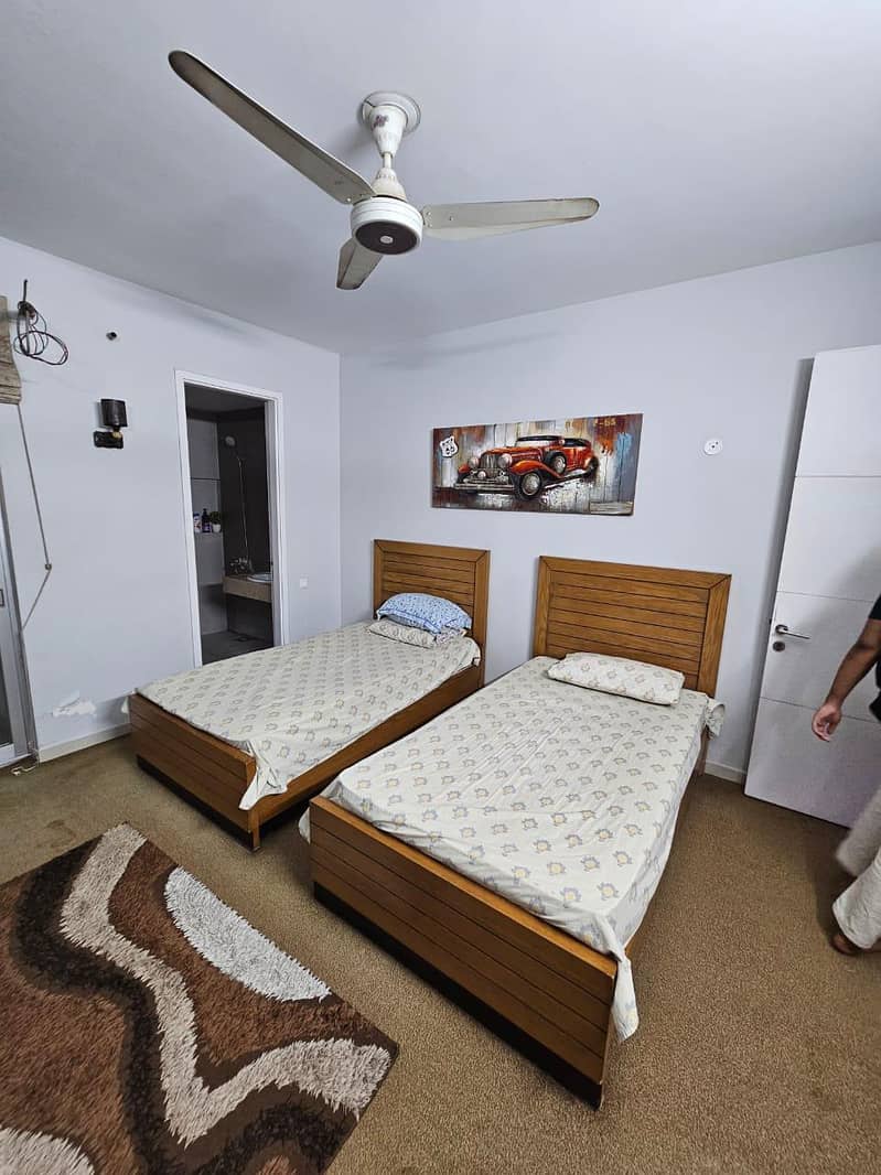 2 single bed and one side table 1