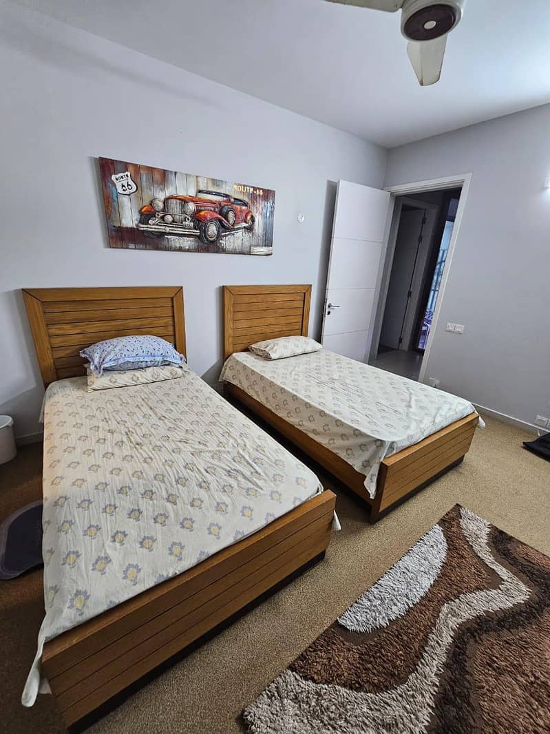 2 single bed and one side table 2