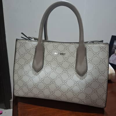 branded structured hand bag