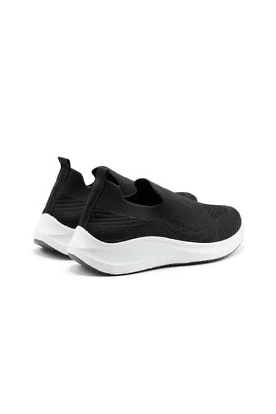 black slip-on sneakers
