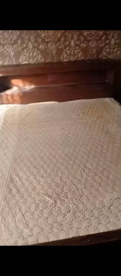 Bed with mattress and dressing table