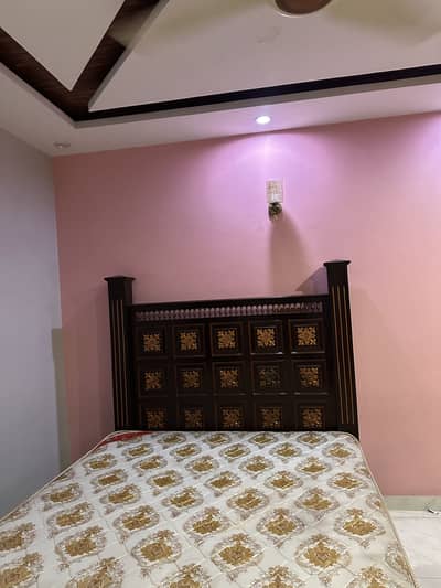 Wooden bed with metress