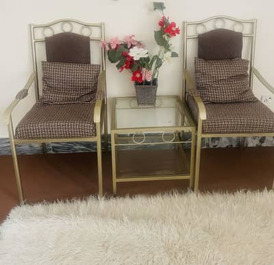 Elegant Cushioned Metal Chairs with Side Table