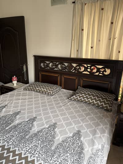 Wooden strong bed with two side tables