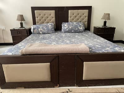 Bedroom with side tables dressing and mattress.