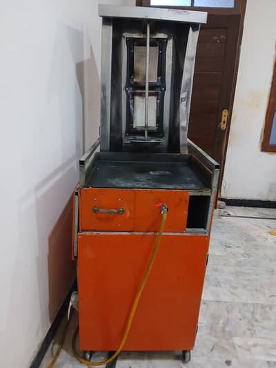 shawarma machine, biryani boiler,  chairs, table, counter