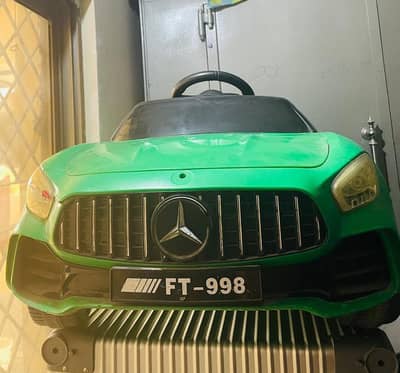 Green electric chargeable car for kids