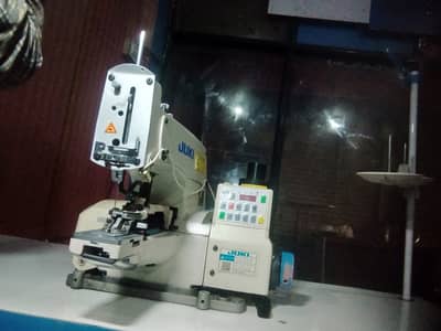 Juki button auto drive machine