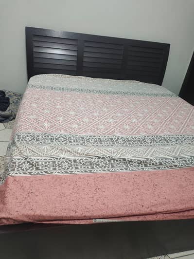 King size wooden bed with mattress