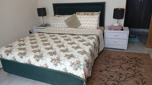 Queen size wooden bed with two side tables