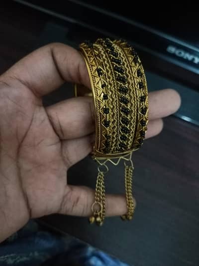 Traditional Gold-Tone Bangle with Black Beads