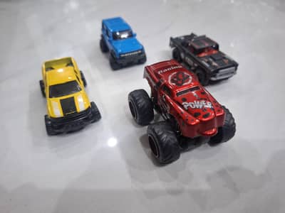 ​"4 Premium Hot Wheels Metal Monster Trucks Pack"