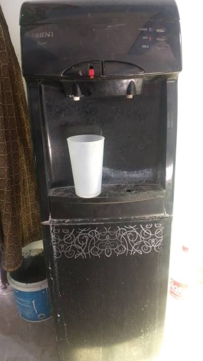 water dispenser and plastic chair