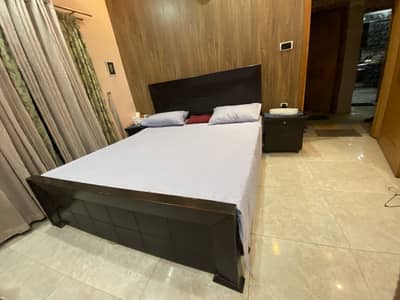 Pure wooden bed with two side tables