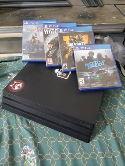 PS4 pro 10/10 condition with 4 games and two controllers