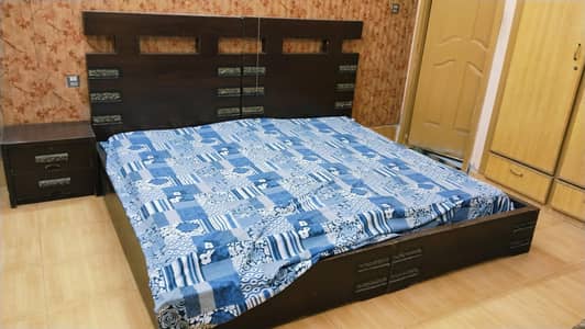 wooden bed in good condition