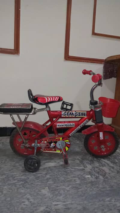 new good condition cycle in one month used in red colour
