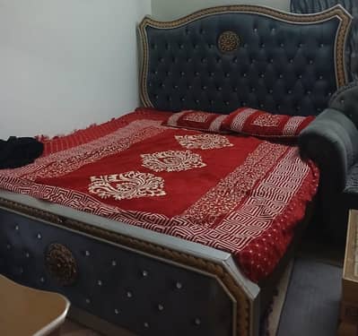 bed, dressing table and sofa