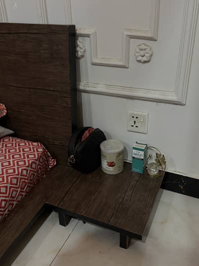 Floor bed with side tables and spring mattress
