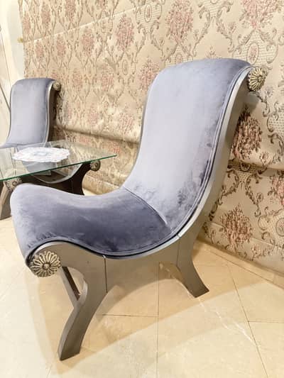 Two bedroom chairs with coffee table