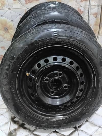 13 inch steel rim with tyres and wheel cups