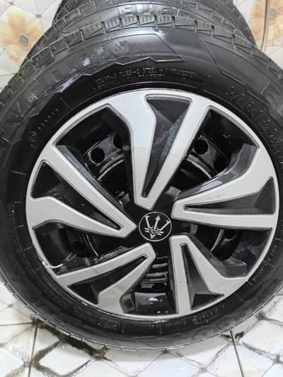 13 inch steel rim with tyres and wheel cups