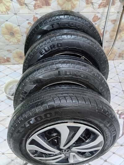 13 inch steel rim with tyres and wheel cups